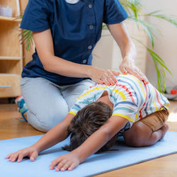 Lower back stretch with physical therapist.