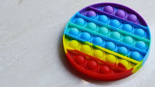 High angle view of multi colored candies in container