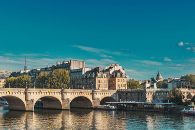 Bridge over river against blue sky