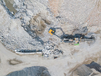 High angle view of earth mover digging land