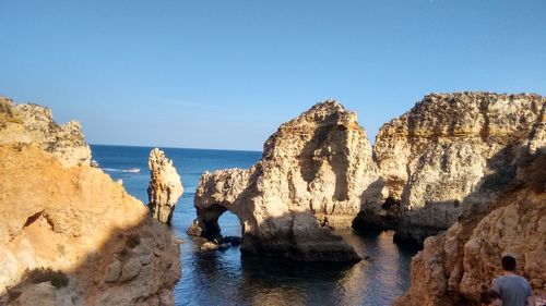 Panoramic view of sea against clear blue sky