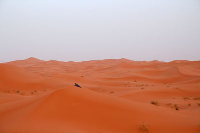 Scenic view of desert against clear sky