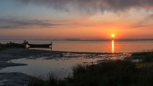 Scenic view of sea against sky during sunset