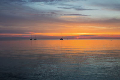 Scenic view of sea against sky during sunset