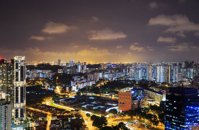 High angle view of illuminated city buildings at night