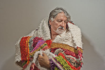 Portrait of man against snow