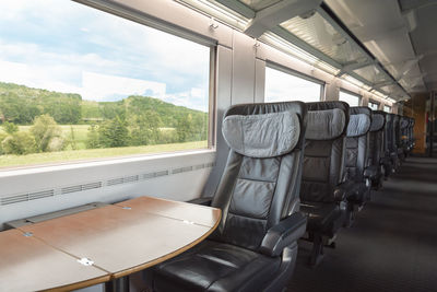 Intercity-express train interior with empty seats, at business class. high-speed german train.