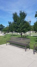 View of park bench by footpath