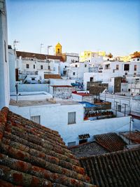 High angle view of buildings in city against sky