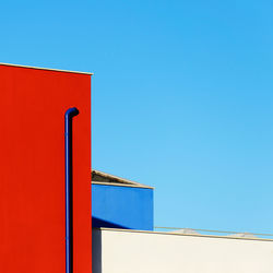 Low angle view of building against clear blue sky