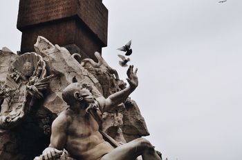 Low angle view of statue against clear sky