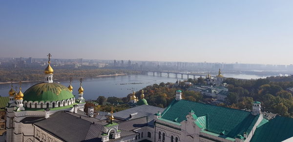 Panoramic view of buildings in city against clear sky