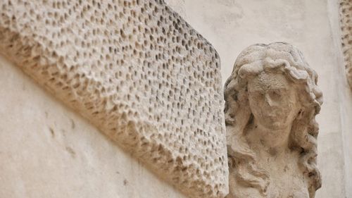 Close-up of statue against wall