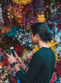 Young woman using mobile phone outdoors