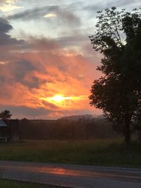 Scenic view of field against sky during sunset