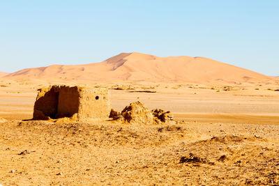 Scenic view of desert against clear sky