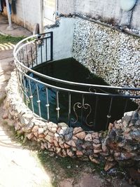 High angle view of retaining wall by water