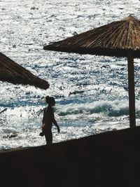 Silhouette man standing on beach