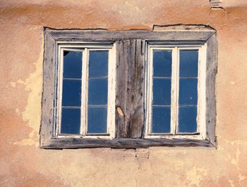 Low angle view of window of old building