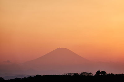 Scenic view of silhouette mountains against sky during sunset