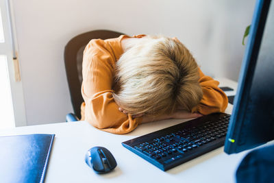 Woman using laptop at home