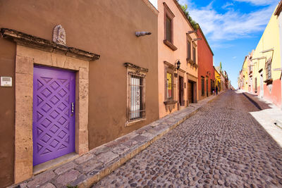 Road amidst buildings in town