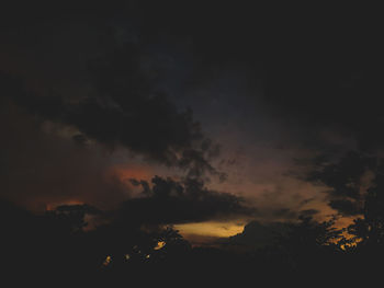 Low angle view of dramatic sky at sunset