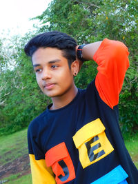 Portrait of boy standing outdoors