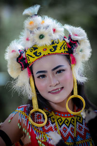 Portrait of smiling young woman in traditional clothing