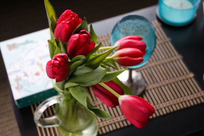 Close-up of red tulips in vase on table