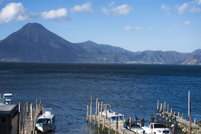 Panoramic view of sea and mountains against sky