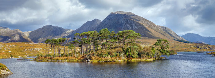 Scenic view of lake and mountains against sky