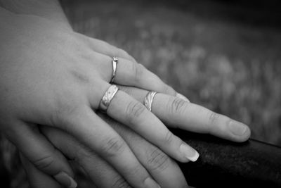 Close-up of couple holding hands