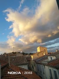 High angle view of buildings in city against sky