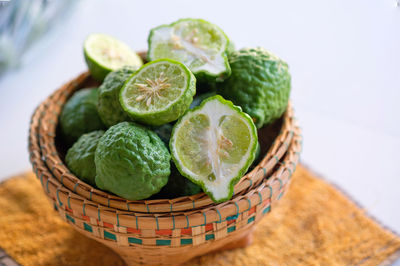 Close-up of green bergamot in basket on table