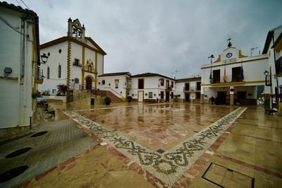 Buildings in city against sky