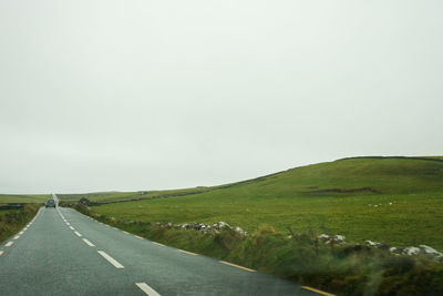 Empty road against clear sky