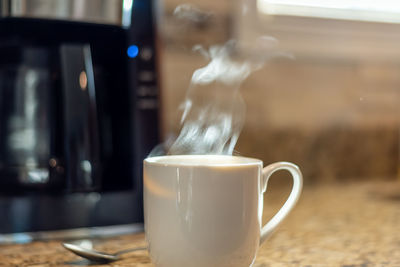 Close-up of coffee cup on table