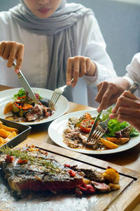 Midsection of man having food