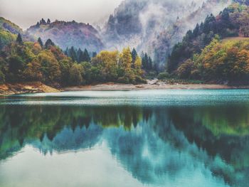 Scenic view of lake against mountain range