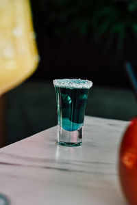 Close-up of beer glass on table