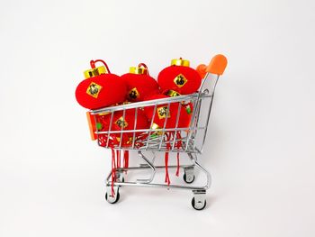 Close-up of red fruit against white background