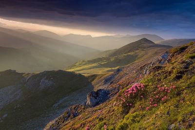 Scenic view of mountains against sky during sunset