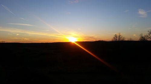 Scenic view of silhouette landscape against sky during sunset