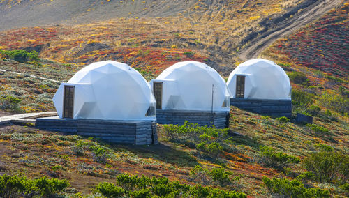 White glamping on the slope of a volcano in autumn on the kamchatka peninsula