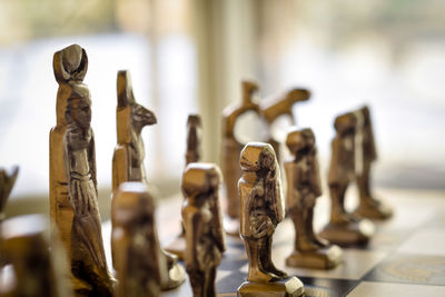 Close-up of chess pieces on table