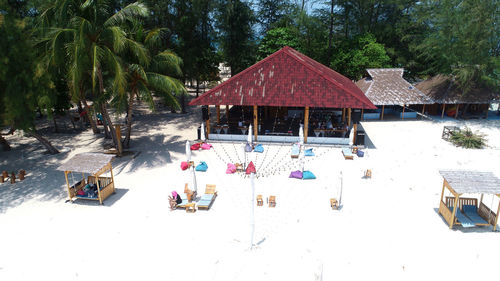 High angle view of houses on beach against trees