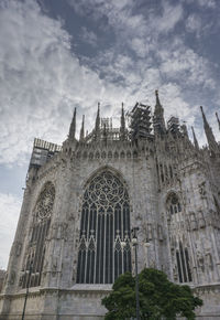 Low angle view of cathedral against cloudy sky