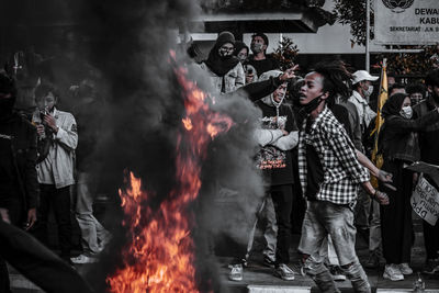 People standing by fire hydrant