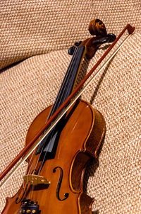 Close-up of violin on seat